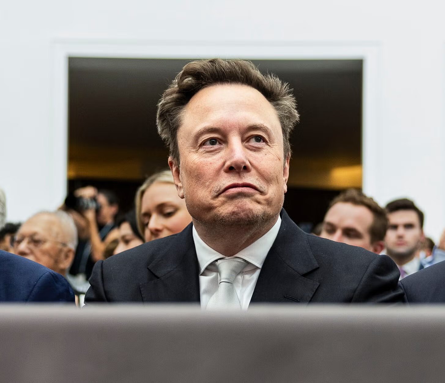 Elon Musk in a dark suit at a formal event in Washington